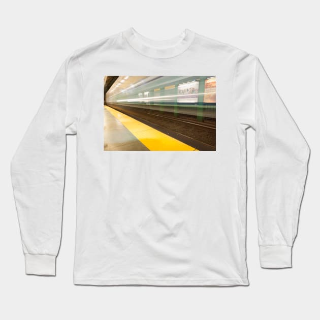 Platform with yellow line railway tracks blurred in motion blur aws train passes. Long Sleeve T-Shirt by brians101